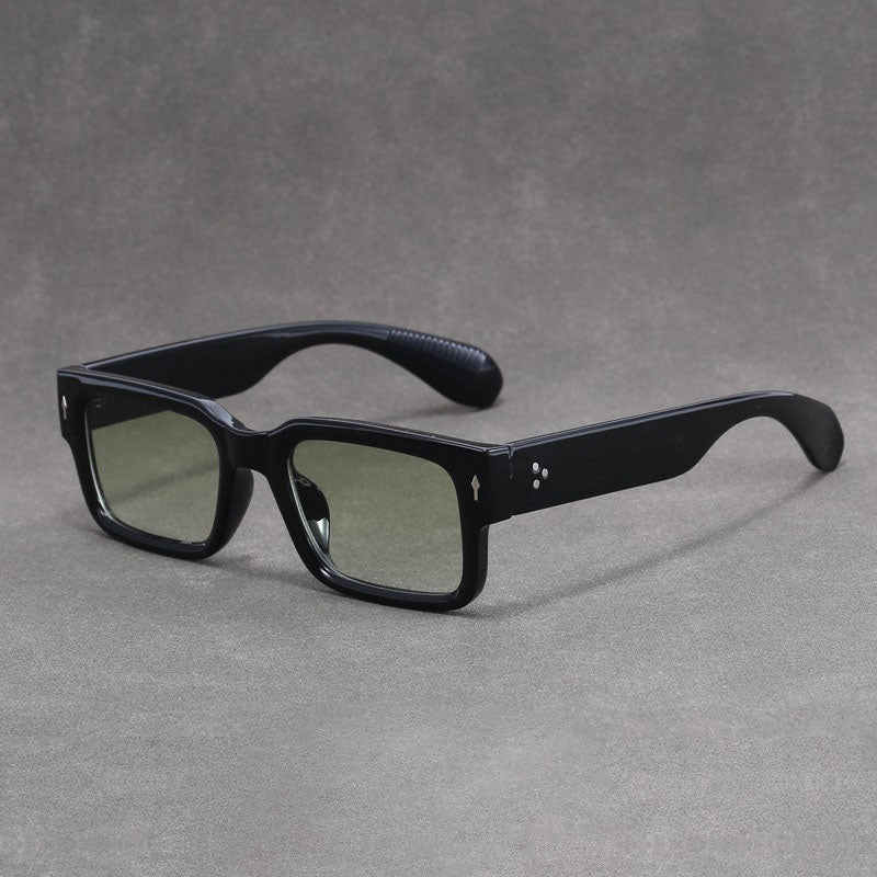 Black sunglasses on a gray background