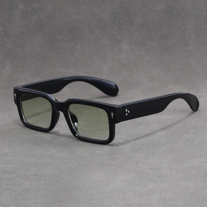 Black sunglasses on a gray background