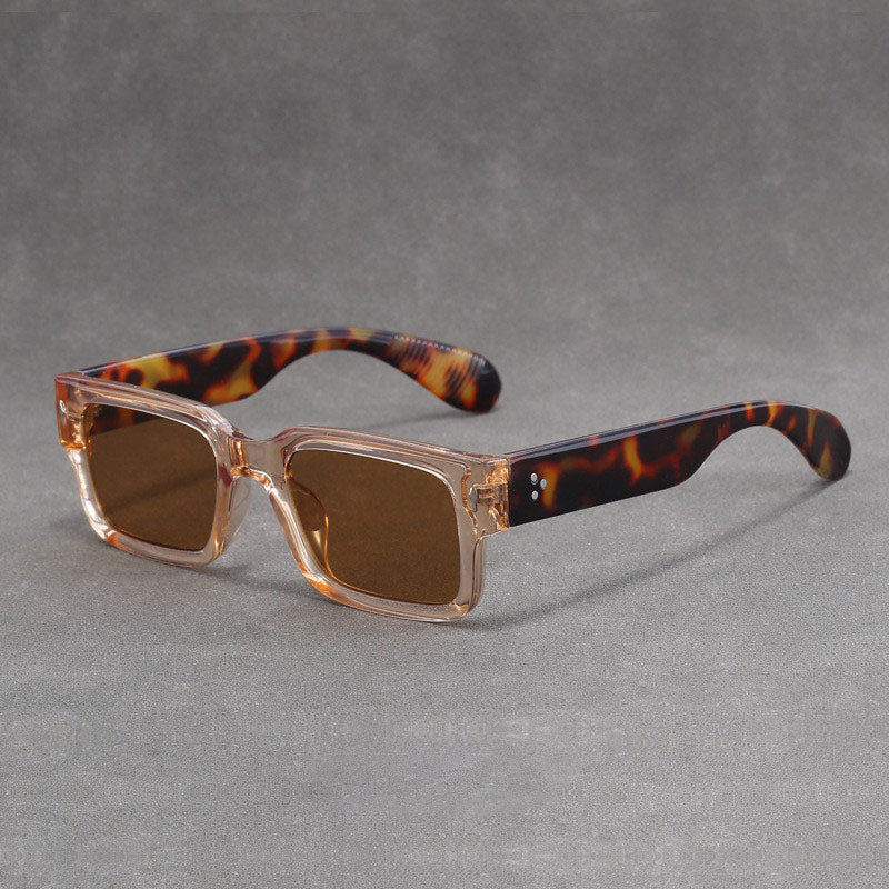 Sunglasses with tortoiseshell arms on a gray background