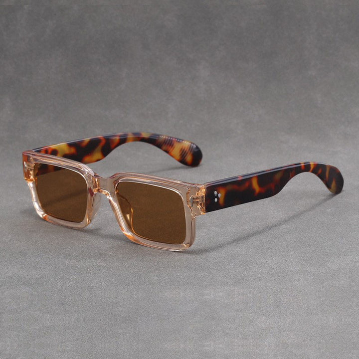 Sunglasses with tortoiseshell arms on a gray background